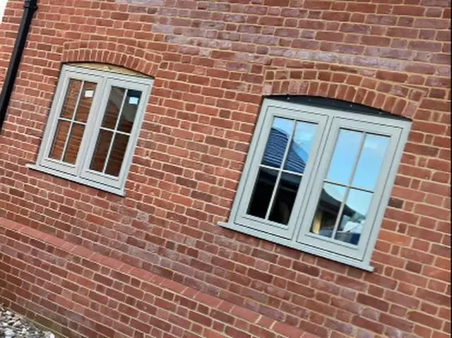 Pair of painted timber windows with glazing bars